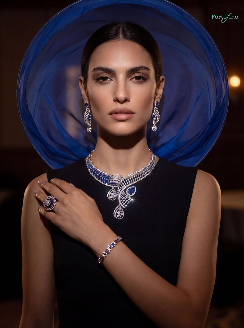 Fortofino model wearing natural diamond jewellery, navy backdrop